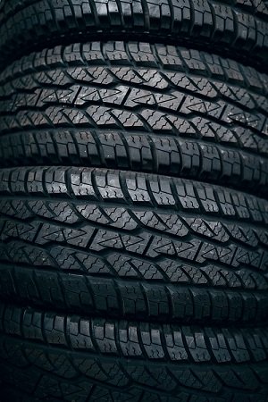 Close-up image of stacked car tires