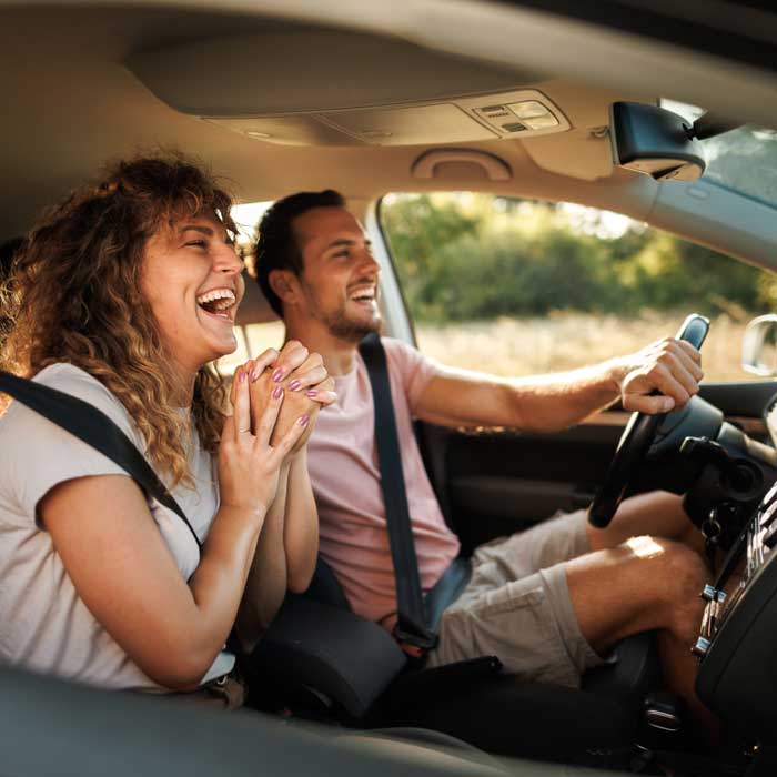 couple laughing in car